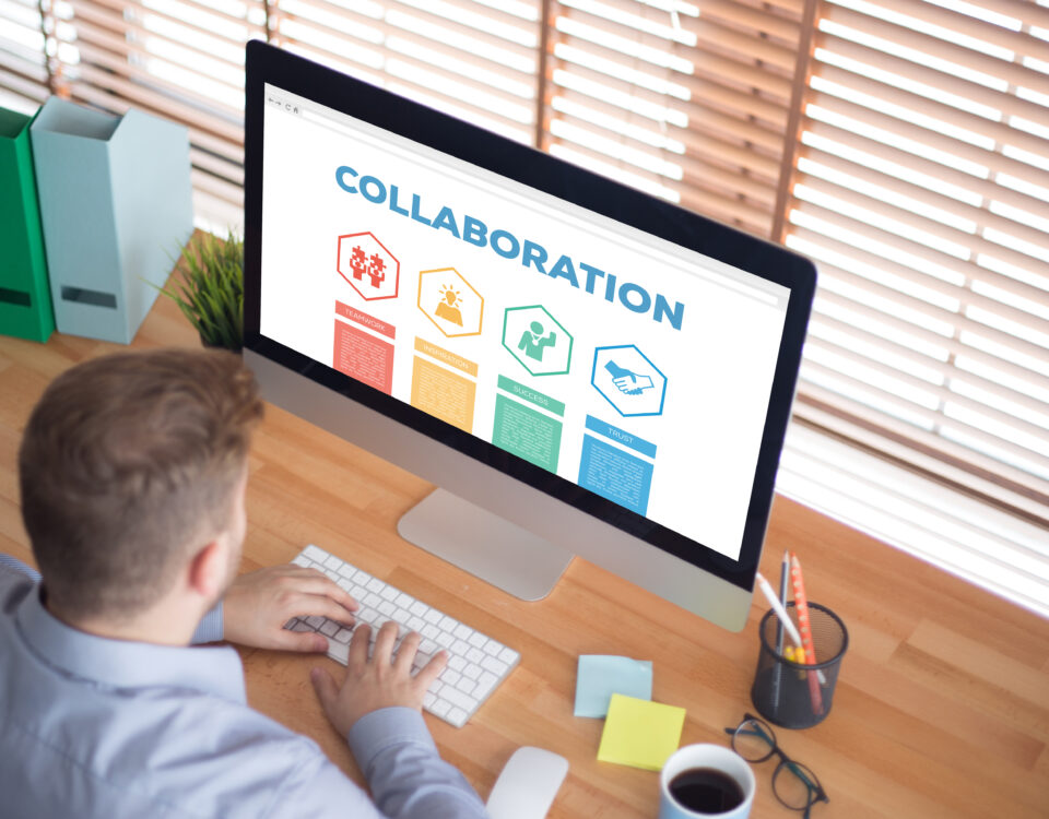 man looking at a computer screen showing chart of collaboration goals