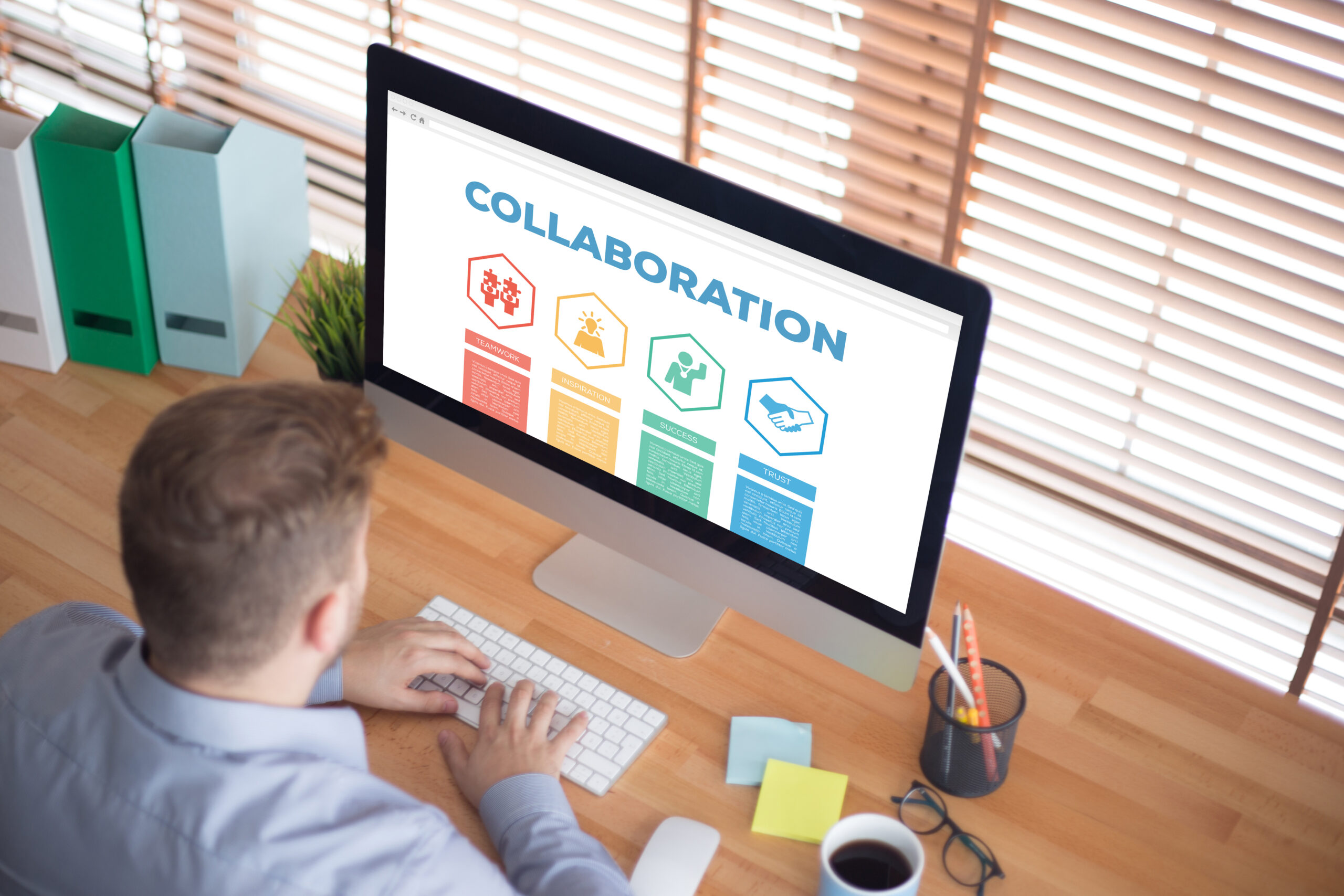 man looking at a computer screen showing chart of collaboration goals