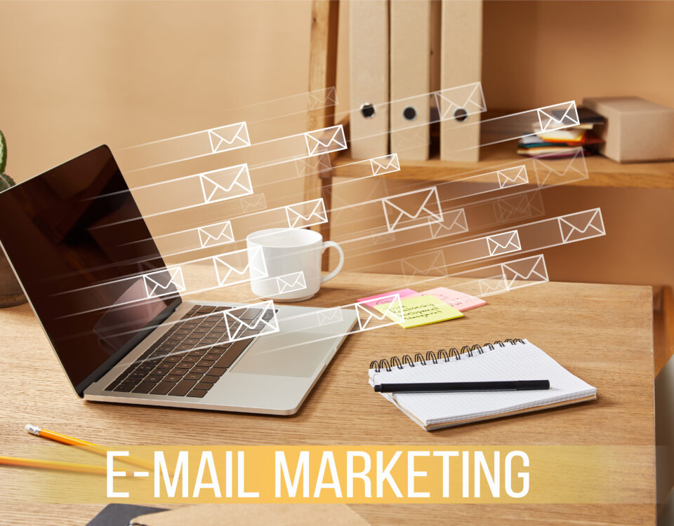 image of email envelopes flying out of laptop